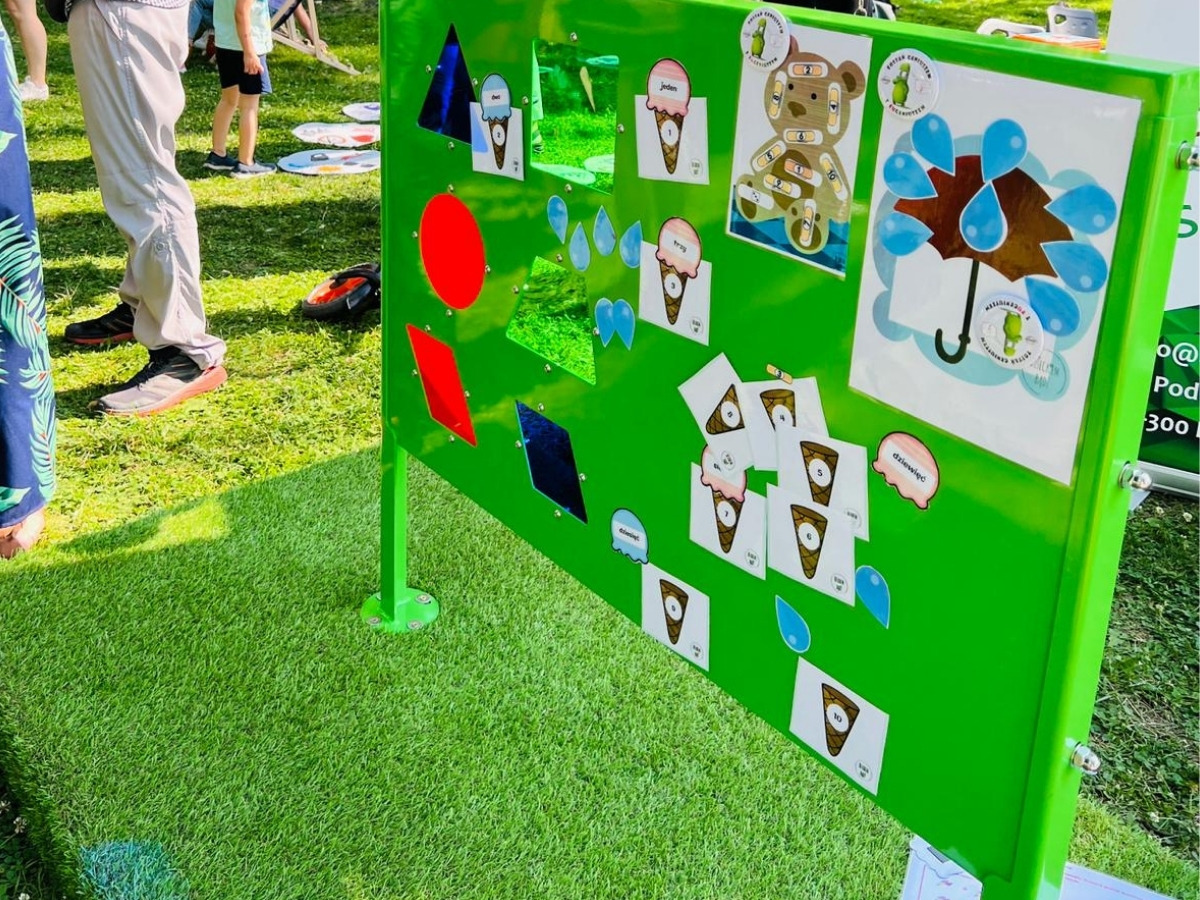 A child writing with a dry-wipe marker on the metal side of the S09 Educational Board Pythagoras