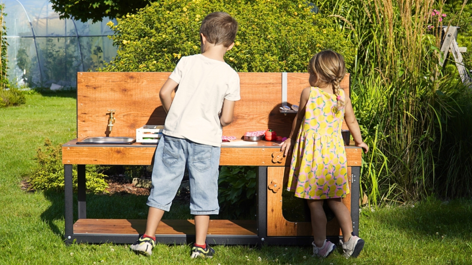 Children at a mud kitchen